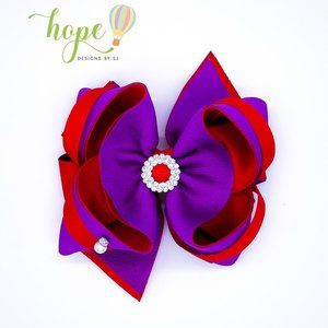 Cute hair bow for this precious holidays. Purple and red with rhinestones.